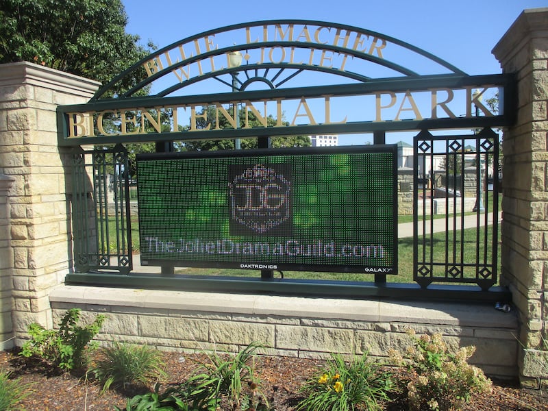 A Joliet Drama Guild graphic is shown on the electronic sign at the entrance monument for Billie Limacher Bicentennial Park in Joliet. Sept. 26, 2025