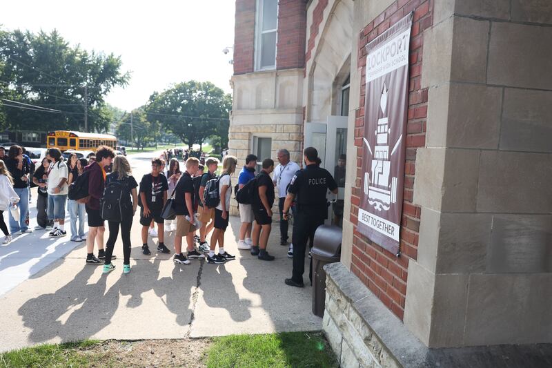 Students enter Lockport Township High School Central Campus on the first day of the new school year on Monday, August 19, 2024.