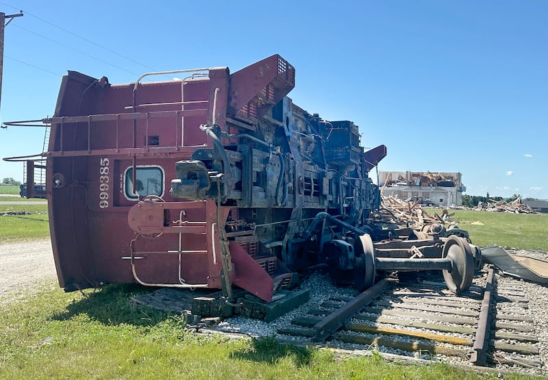 A caboose is blown off of it's tracks near the entrance of Rothrock Airport on Monday, June 15, 2026 in Streator.