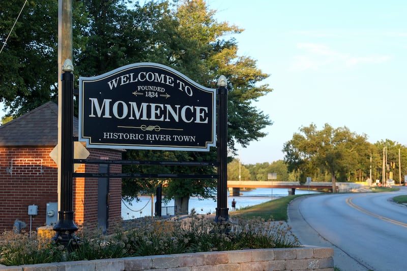 A sign welcomes travelers to the city of Momence.