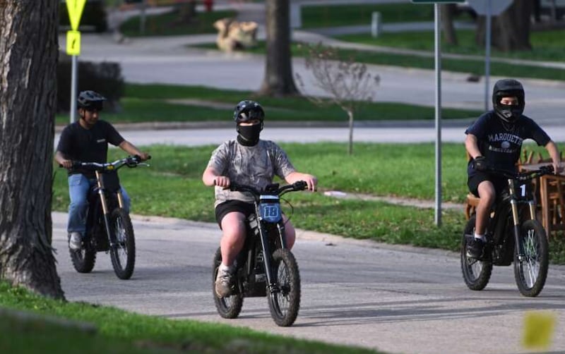 E-moto riders travel along a section of the McHenry County Prairie Trail in Crystal Lake on Tuesday.