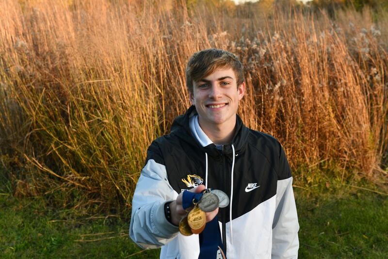 Herscher's Drew Rogers poses with his medals from state competitions throughout high school in Nov. 2021.