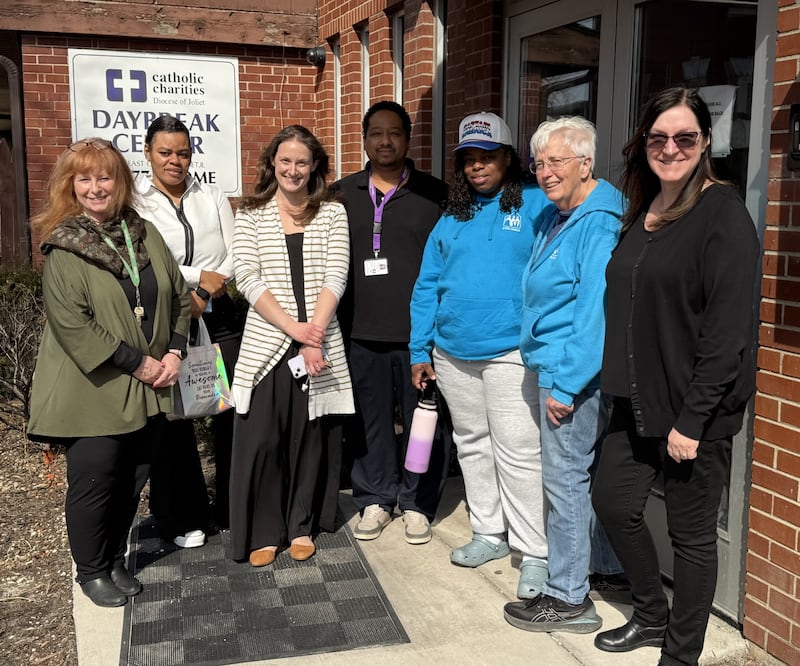 On March 11, Diane Nilan, author, national speaker, homeless activist, and Melissa Agunloye of Bolingbrook, the mother of seven children who experienced homelessness for many years, shared tips and resources with mothers experiencing homelessness at Daybreak Center in Joliet. Pictured (from left) are Barb Sullivan-Thurlby (director of community services), Portia Sturdivant (residential support supervisor, Daybreak Center), Colleen Conwood (director of Daybreak Center). Bill Anderson (assistant director of Daybreak Center), Melissa  Agunloye of Bolingbrook, Diane Nilan, Stephanie Ambrose (manager of volunteers and donations, Daybreak Center).