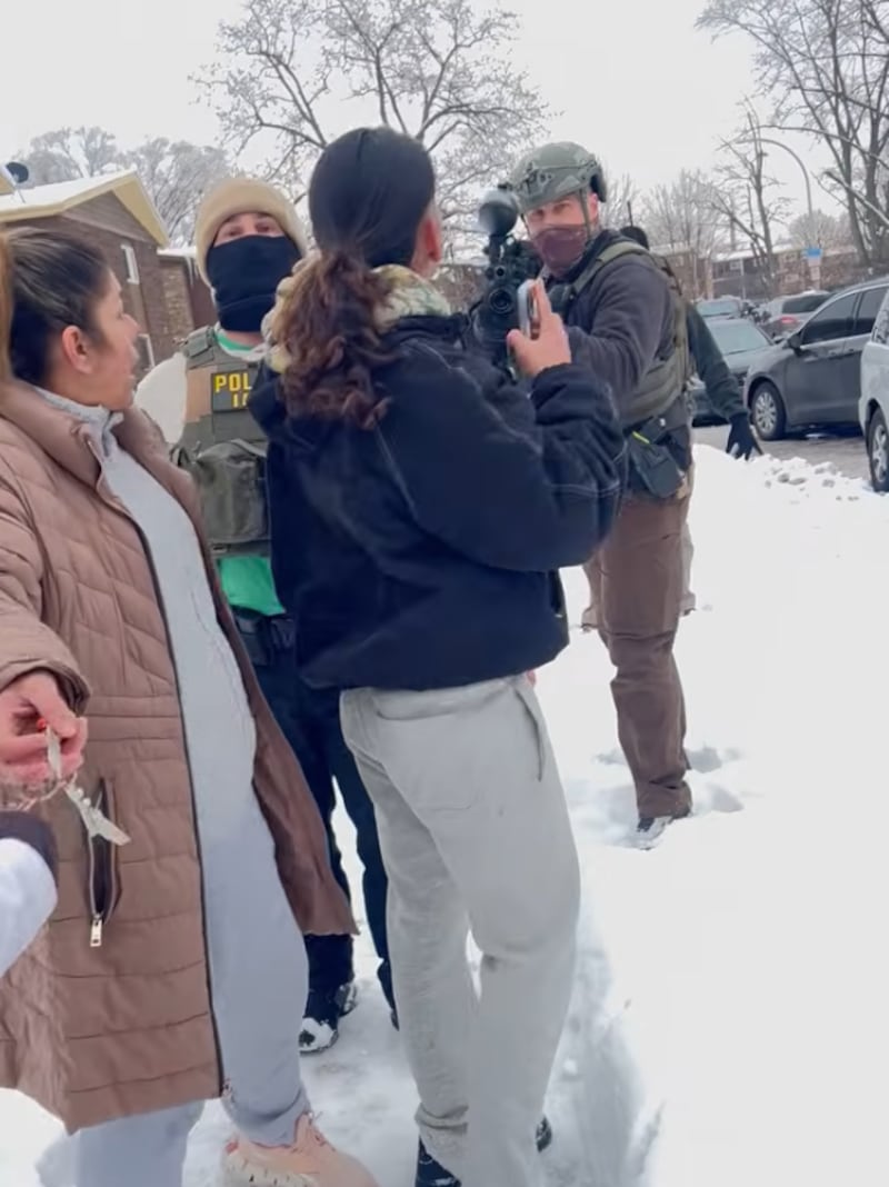 A still from a video released by the Kane County State's Attorney's Office on April 30, 2026, shows what prosecutors say is an ICE agent shooting a pepper ball at protesters that struck a man, ricocheted off him and struck a woman in the face on Dec. 6, 2025.