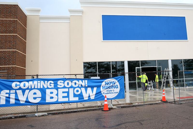 Crews install the front doors to the new Five Below store on Tuesday, July 8, 2025 between Kohl's and PetSmart in Peru. The 10,083 square foot building. Five Below is a chain of specialty discount stores that prices most of its products at $5 or less with a smaller assortment of products priced up to $25.