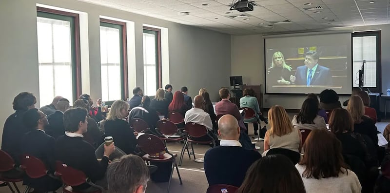 Lobbyists with a variety of health and human service organizations across Illinois watch Gov. Pritzker’s annual budget address at the Illinois State Library on Wednesday, Feb. 18, 2026.