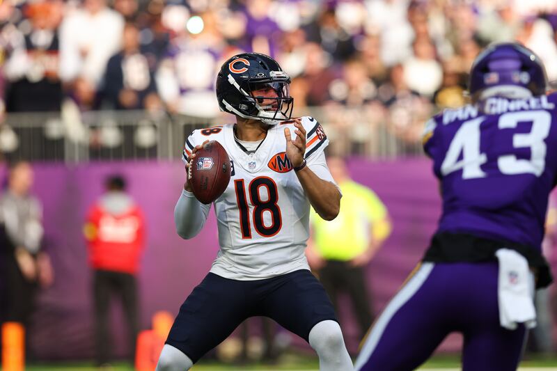Chicago Bears quarterback Caleb Williams handles the ball during the first half of an NFL football game against the Minnesota Vikings, Sunday, Nov. 16, 2025 in Minneapolis. (AP Photo/Stacy Bengs)