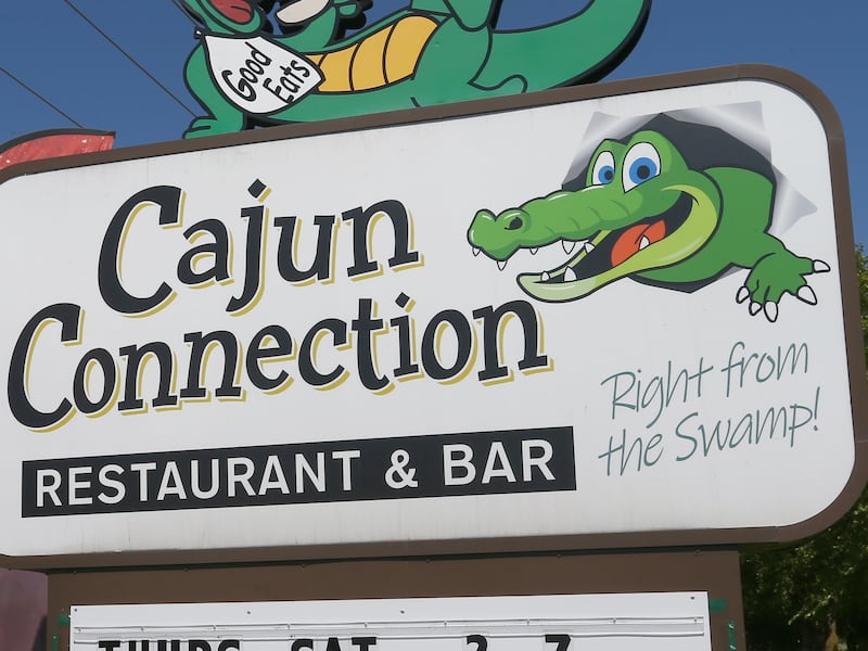 Cajun Connection owner Ron McFarlain poses for a photo outside his restaurant on Wed. Aug. 24, 2022. After 28 years in business the Cajun Connection is closing in Utica.