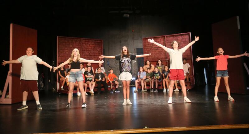 The cast of Beatlejuice (from left)  Jackson Layhew, Nina Leffers, Brynlen Bock, Nathan Leffers and Julia Smith act out a scene on Tuesday, July 29, 2025 at Stage 212 in La Salle.