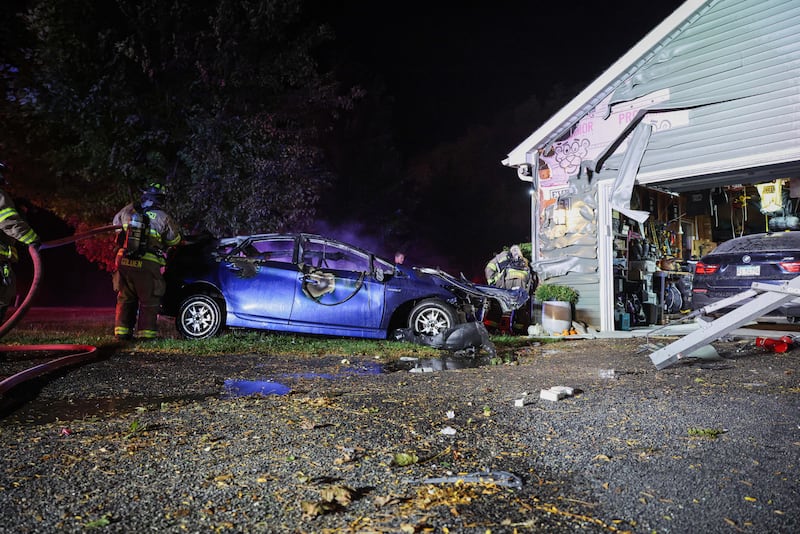 The Marengo Fire & Rescue Districts put out a car and house fire from a fatal crash at the 22800 block of River Road near Marengo on Oct. 13, 2025.