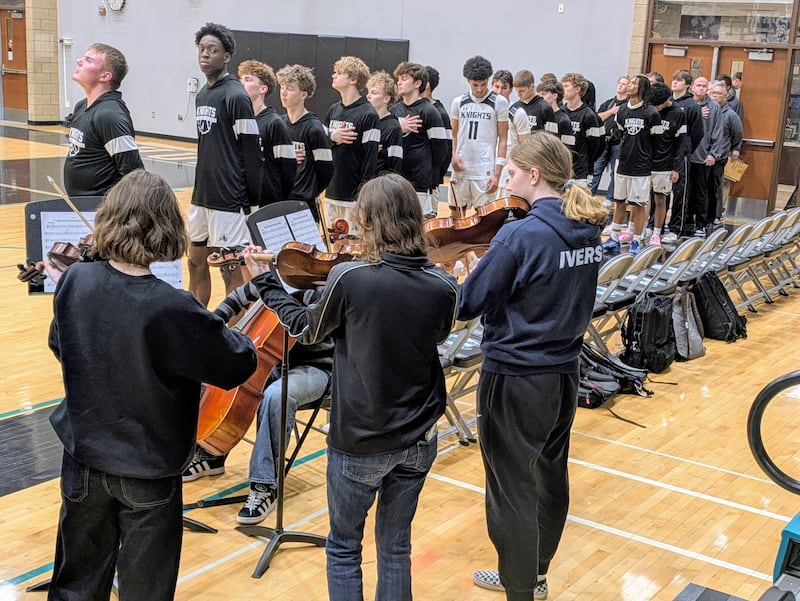 Kaneland players line up for the national anthem, played by a Woodstock North High School string quartet, before a Woodstock North Sectional semifinal on Tuesday, March 3, 2026. The Knights beat Rockford East 64-44.