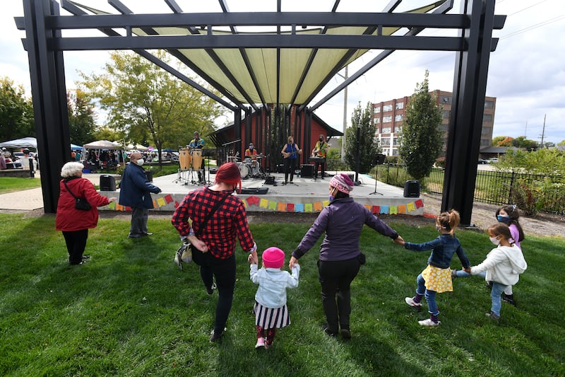 Attendees dance to Latin during the City of Kankakee’s Hispanic Heritage Month celebration in 2020 at the Kankakee Train Depot. Local events have been canceled or postponed due to the presence of federal immigration agents in the area.