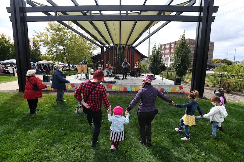 Attendees dance to Latin during the City of Kankakee’s Hispanic Heritage Month celebration in 2020 at the Kankakee Train Depot. Local events have been canceled or postponed due to the presence of federal immigration agents in the area.