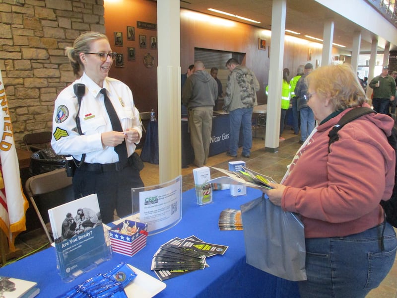 Amy Altenbern (left) with the Plainfield Emergency Management Agency shares information on disaster preparedness with Fran Stevenson of Joliet before the start of the "When Seconds Matter" workshop on Saturday in Plainfield. March 22, 2025