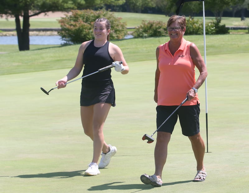 Allie Thome and Beth Worsley smile after walking off the sixth hole during the Illinois Valley Womens Golf Championship on Saturday, Aug. 11, 2024 at Deer Park Golf Club in Oglesby.