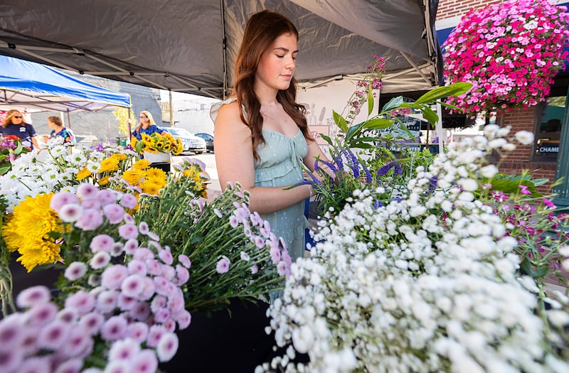 Grace Gates of Rock River Flora makes a fresh cut flower bouquet Wednesday, Aug. 21, 2024, at Dixon City Market. Gates can be reached at rockriverflora on Instagram and Facebook.