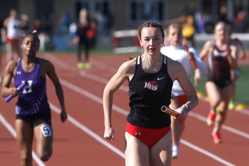 Huntley’s Addison Busam runs the final leg of the 4x100 meter relay for her team on Thursday, May 8, 2025, during the Fox Valley Conference Girls Track and Field Meet at Huntley High School.