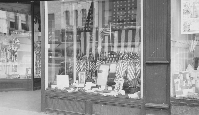 The windows of M.F. Malone's store, 230-234 East Lincoln Highway in downtown DeKalb decorated for Memorial Day, 1942.