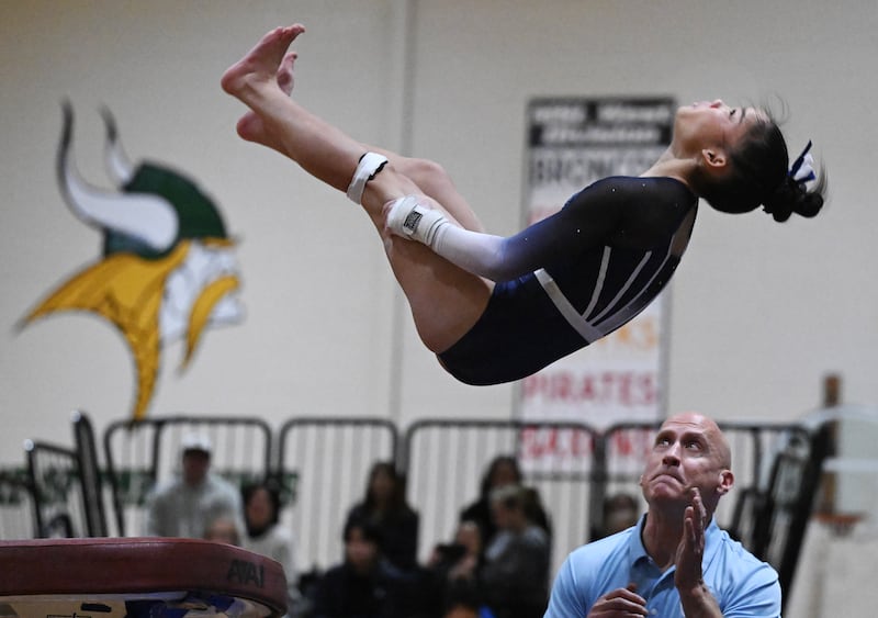 St. Charles Coop’s Payton Han competes on vault during the Fremd gymnastics regional on Thursday, Feb. 5, 2026 in Palatine.