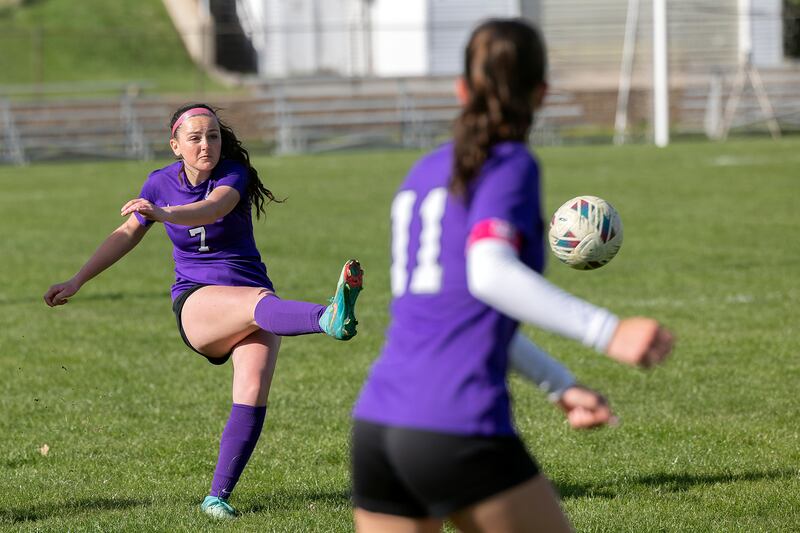 Dixon’s Madeline McLane takes a shot against North Boone Tuesday, April 15, 2025.