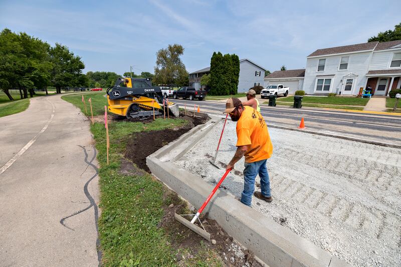 Employees with Stitcher Construction of Erie work on the new parking area at Thomas Park in Sterling on Thursday, Aug. 7, 2025. The new lot will help alleviate local congestion for the popular pickleball courts.