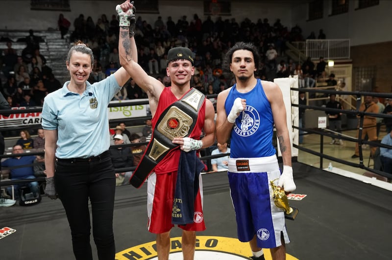 Anthony Mancilla, center, is named the winner of the 132 pound open division Chicago Golden Gloves title match on Aprul 11, 2025.