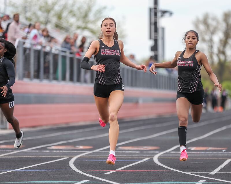 Plainfield North's Lauren Dellangelo (L) and Aniya Poindexter finish first and second in the 100m during Southwest Prairie Conference Girls Track and Field Meet Wednesday, May 7, 2025 in Minooka.
