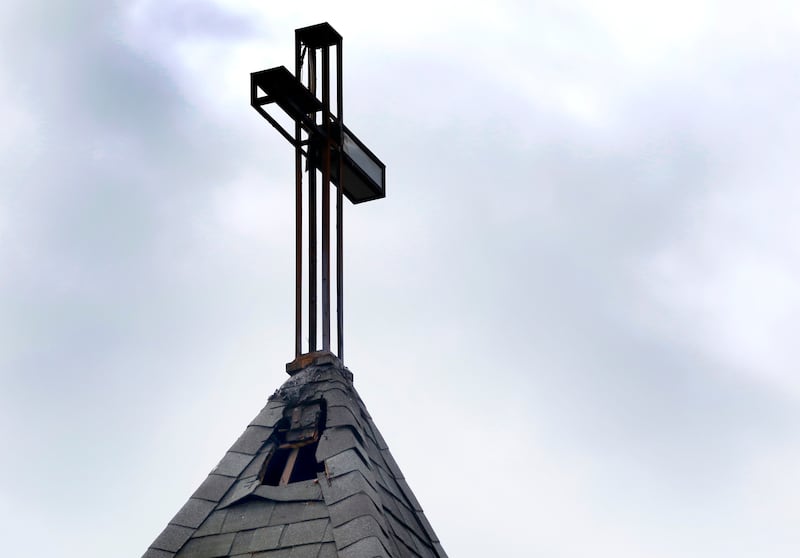 A hole in the steeple of the St. John’s Lutheran Church on Friday, July 11, 2025, after a fire overnight at the Hebron church.