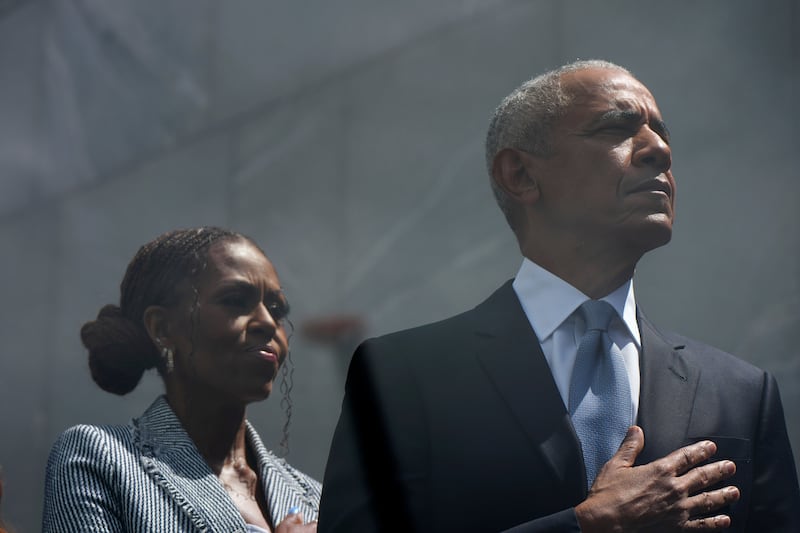Former President Barack Obama and former First Lady Michelle Obama on stage during the dedication ceremony for the Obama Presidential Center, Thursday, June 18, 2026, in Chicago. (AP Photo/Alex Brandon)