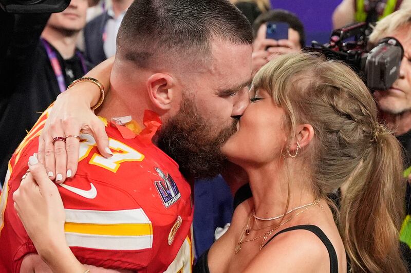 FILE - Kansas City Chiefs tight end Travis Kelce (87) and Taylor Swift kiss after the Chiefs defeated the San Francisco 49ers in the NFL Super Bowl 58 football game on Feb. 11, 2024, in Las Vegas. (AP Photo/John Locher, File)