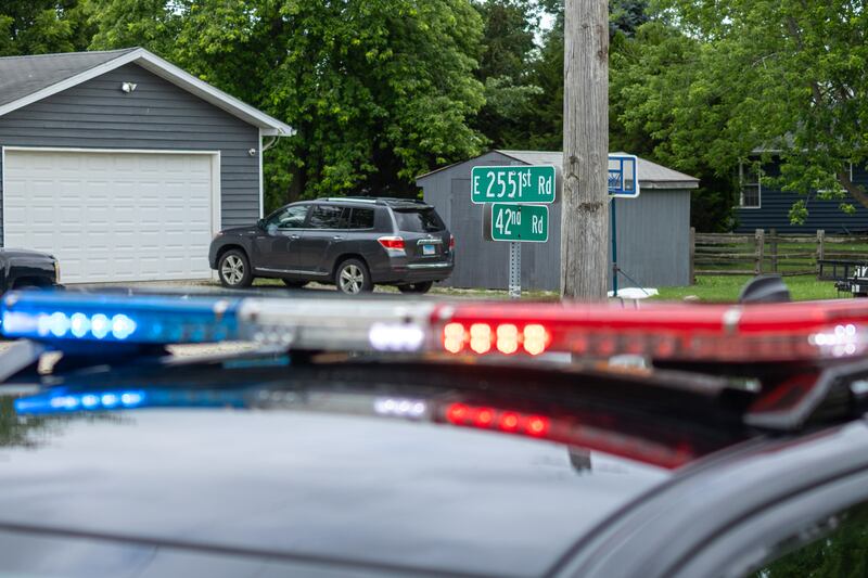 Police lights, flash under street sign of 5221st & 42nd road at crime scene of double homicide on Thursday, July 17, 2025 on 42nd Road in Sheridan.