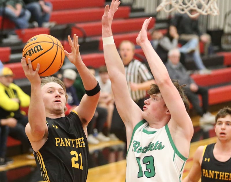 Rock Falls's Austin Castaneda eyes the hoop against Putnam County's AJ Furar during the 50th annual Colmone Classic on Monday, Dec. 9, 2024 at Hall High School.