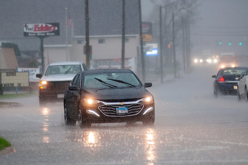 Rain floods the streets of Rock Falls Friday, April 22, 2022. The Sauk Valley was hit with a deluge of rain and high winds.