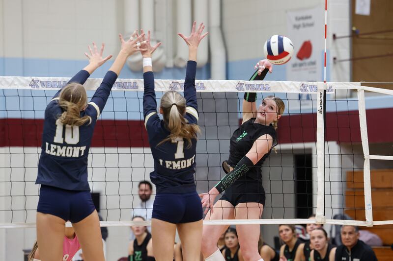 Providence's Abbey Knight sends the ball around Lemont blockers during Providence's victory in two sets, 25-25, 25-18, over Lemont in the IHSA Class 3A Kankakee Sectional championship on Thursday, Nov. 6, 2025.
