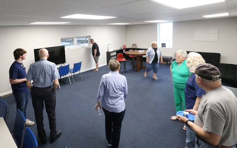 People tour the high school room during a open house on Thursday, April 24, 2025 at the Second Story Teen Center in Princeton. Donors were invited to see the new building. The center officially opens next Tuesday.