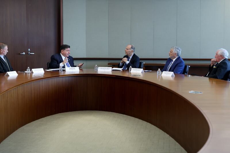 Illinois Gov. JB Pritzker, second from left, meets with former military generals and admirals in Chicago, Thursday, Oct. 16, 2025, (Antonio Perez/Chicago Tribune via AP, Pool)