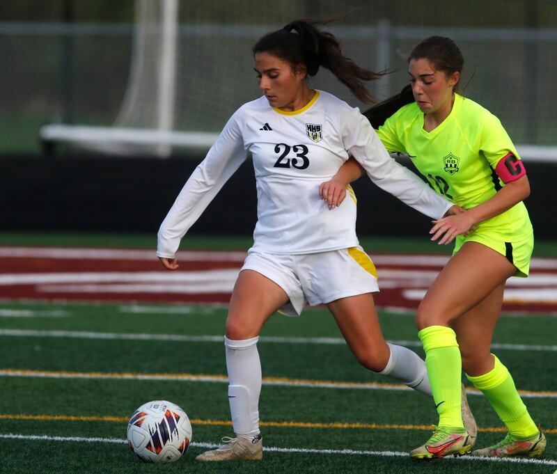 Harvard's Julie Silva controls the ball in front of Richmond-Burton's Nicole Mendlik during the Kishwaukee River Conference Girls Soccer Tournament Championship Match on Wednesday, May 7, 2025, at HRichmond-Burton High School in Richmond.