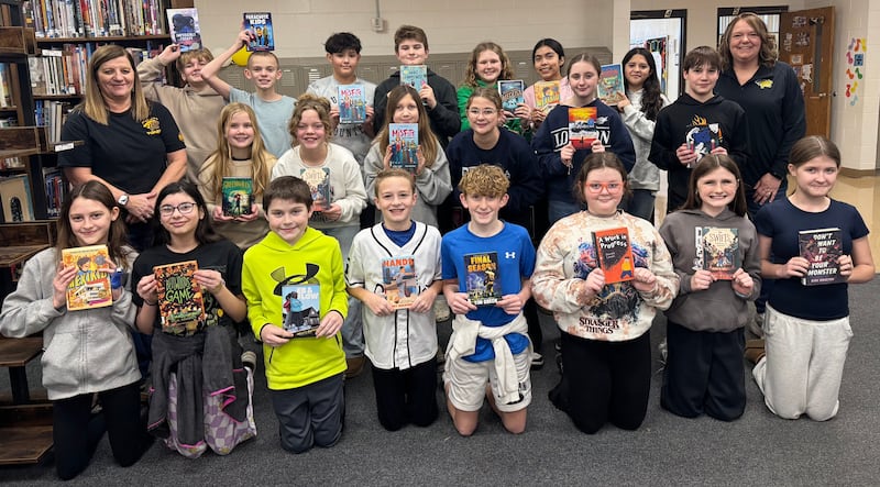 Putnam County Junior High School sixth grade students TJ Kramarsic (back row, from left), Bryson Smith, Jaxon Zuniga, Blake Richardson, Reese Lenkaistis, Sophia Lozano, Alina Aguilar, sixth grade ELA teacher Amy Carboni, school media paraprofessional Debbie Thompson (middle row), students Josie Heeley, Penny Bird, Madelyn Keigley, Madelyn Holst, Addi Bickett, Trey Soule, Arya King (front row), Molly Pundsack, Preston Goetz, Austin Grasser, Jack Vice, Phaelynne Messick, Eden Johnson and Kayleigh Bent. Not pictured are students Stella Guisti, Harper Heuser and Braxton Lopez
