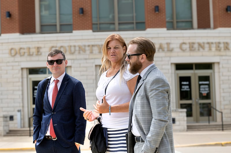 Jodi Wiederkehr with attorneys Brad Thomson (left) and Chris Carraway speak outside of the Ogle County Courthouse Friday, May 29, 2026, following Wiederkehr’s pre-trial hearing.