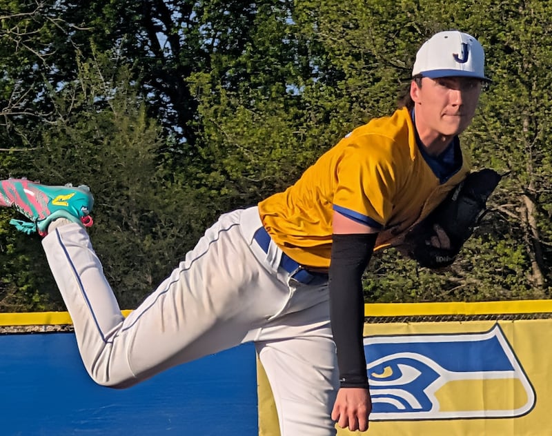 Johnsburg's Peyton Mesce delivers a pitch to the plate against Woodstock in a Kishwaukee River Conference baseball game Tuesday, April 28, 2026, in Johnsburg.