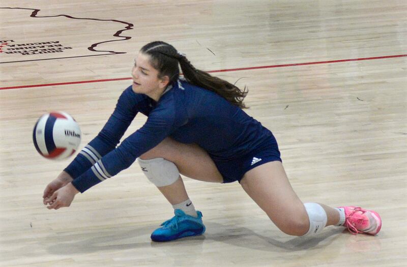 Fieldcrest’s Pru Mangan sets to return a serve against Woodland in the 1st set of Tuesday’s Sub-Sectional match at Woodland.