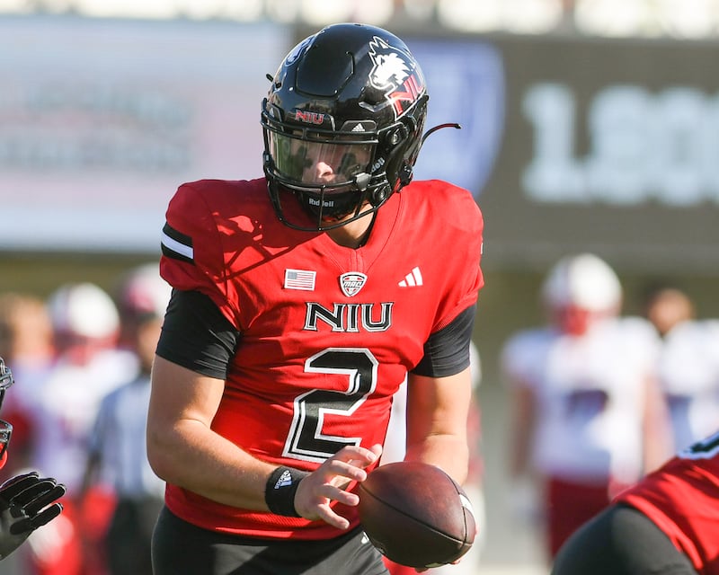 Northern Illinois University's quarterback Brady Davidson (2) prepairs to hand the ball off to running back teammate Chavon Wright (10) during the game on Saturday Oct. 4, 2025, while taking on Miami of Ohio held at Huskie Stadium in DeKalb.