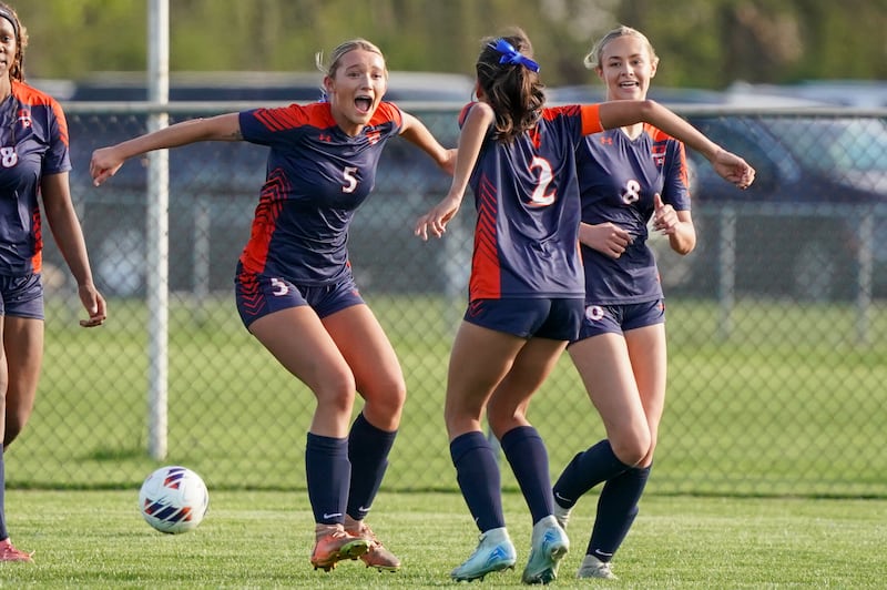 Oswego’s Aubrey Eirich (5) reacts after scoring a goal off of a header against Oswego East during a soccer match at Oswego High School on Tuesday, April 29, 2025.