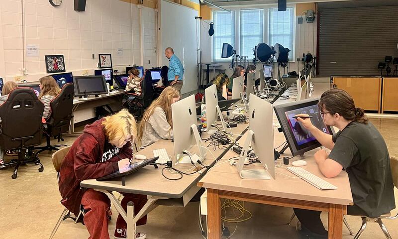Students work on their Digital Media Arts program projects at the Whiteside Area Career Center in Sterling, under the watchful eye of Instructor Denis Mennie.