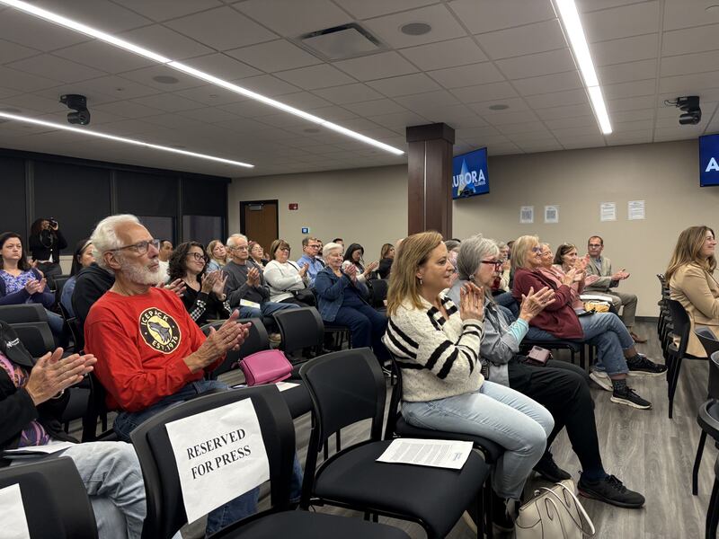 Audience members clap during an immigration forum hosted by U.S. Rep. Lauren Underwood in Aurora Oct. 10, 2025.