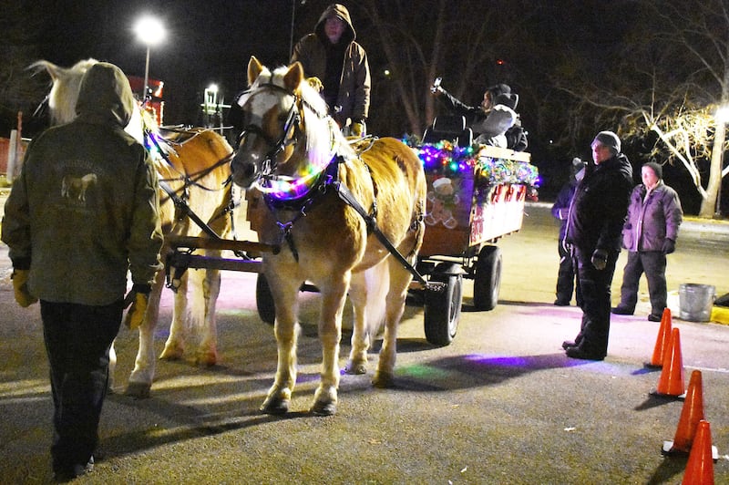 The Ellingston family from Poplar Grove offered horse-drawn wagon rides at the Centennial Park holiday lights display in Rock Falls on Friday, Dec. 19, 2025.