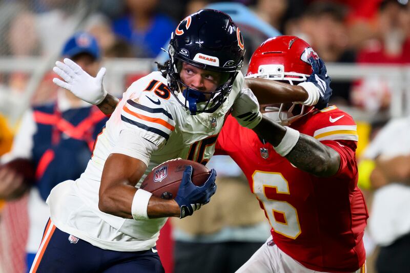 Chicago Bears wide receiver Rome Odunze (15) makes a catch and run against Kansas City Chiefs safety Bryan Cook (6) during the first half of an NFL preseason football game, Friday, Aug. 22, 2025 in Kansas City, Mo. The Bears defeated the Chiefs, 29-27. (AP Photo/Reed Hoffmann)