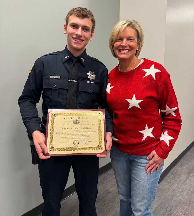 State Rep. Tony McCombie (R-Savanna) (left) presented Polo Patrol Officer Kaden Coppotelli (right) the letter of recognition at a Jan. 20 Polo City Council meeting in honor of his life saving actions during a December 2024 house fire.