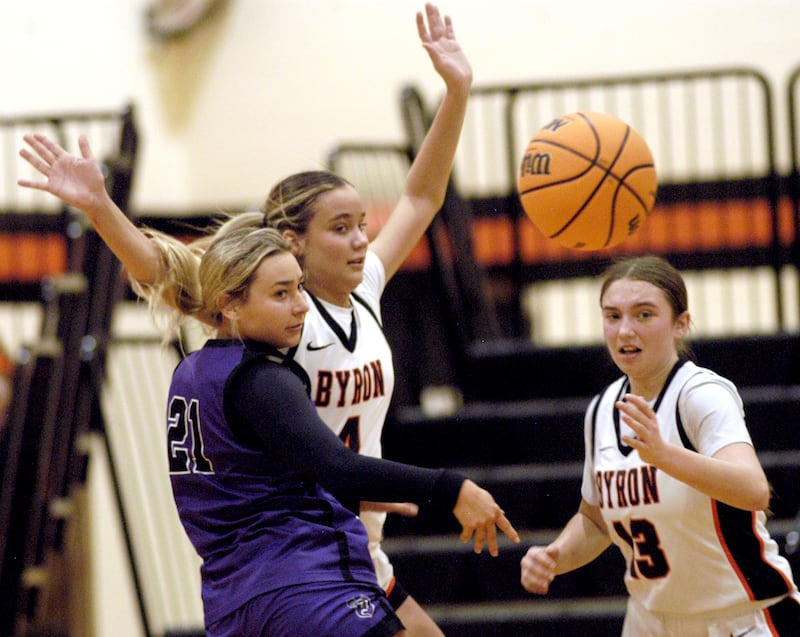 Dixon's Reese Dambman and Byron's Macy Groharing andBrynn Green keep their eyes on the ball. The Byron Tigers won over the Dixon Duchesses 46-43 in overtime. The girls basketball game took place at Byron on Saturday, January 24th, 2026