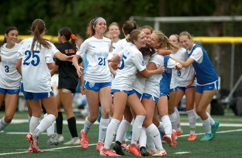 St. Charles North players celebrate their win over St. Charles East in the Class 3A Glenbard West Sectional semifinal game on Tuesday, May 27, 2025 in Glen Ellyn.